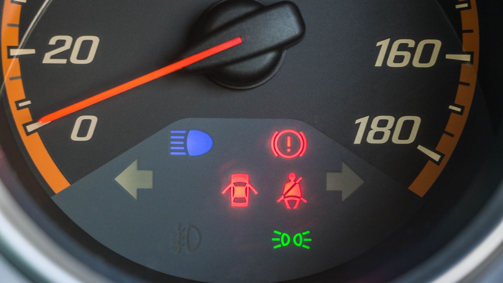 A dashboard cluster with warning lights illuminated